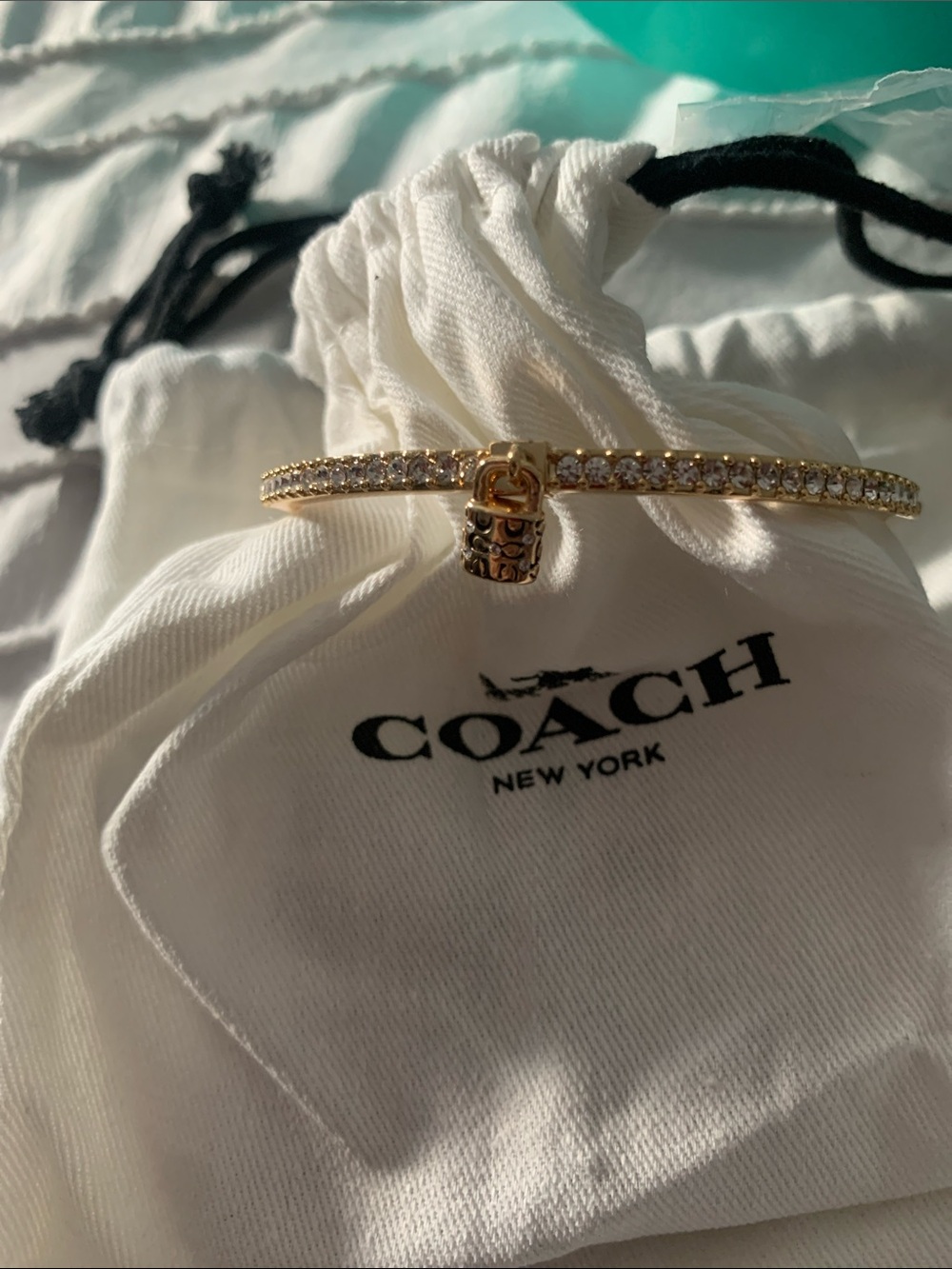 Coach Gold Tone Crystal Bangle with Signature Lock Charm